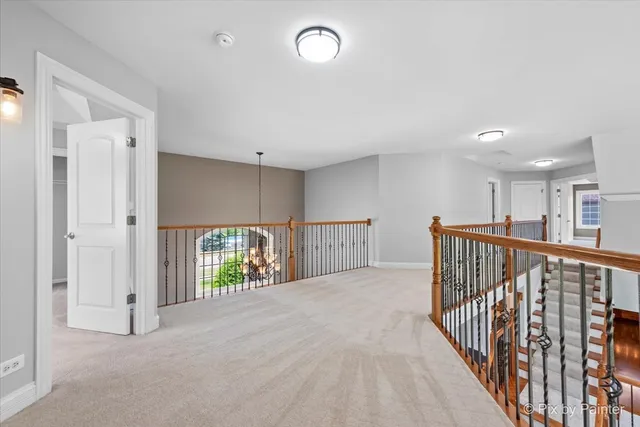 en empty room with windows and ceiling fan