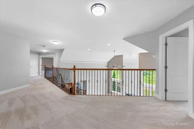 a spacious bathroom with a granite countertop sink mirror and a