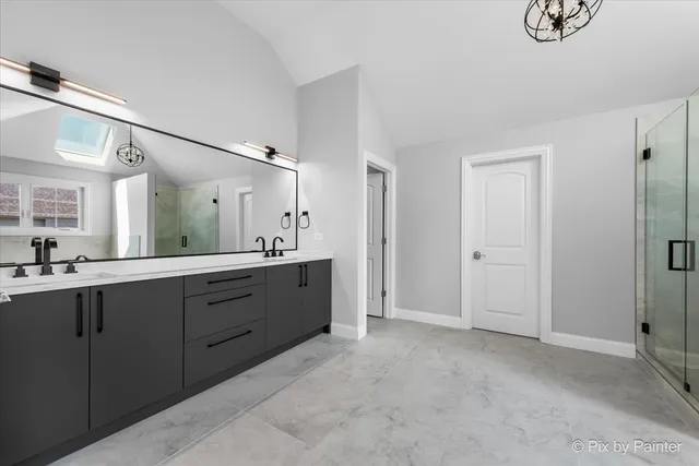 a white toilet sitting next to a bathroom sink