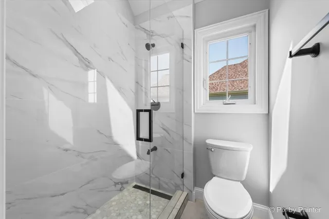 an aerial view of multiple houses with yard