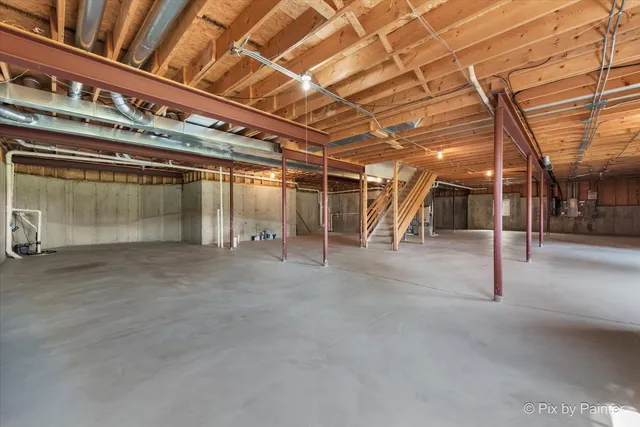 an aerial view of residential houses with outdoor space and river