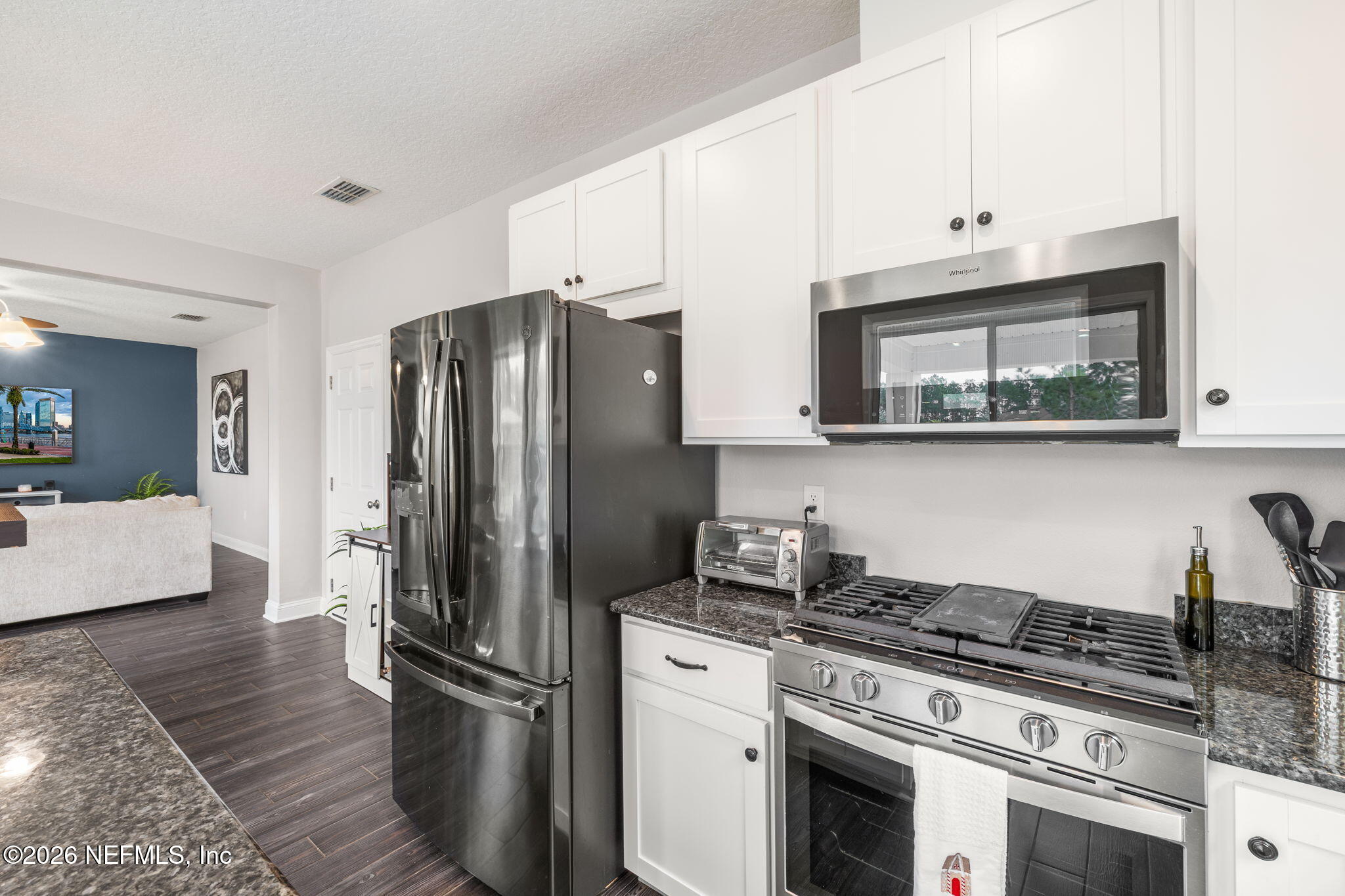 28 Focal Court St. Augustine, FL 32095 - Photo 15 of 54 a kitchen with stainless steel appliances granite countertop a refrigerator stove and sink