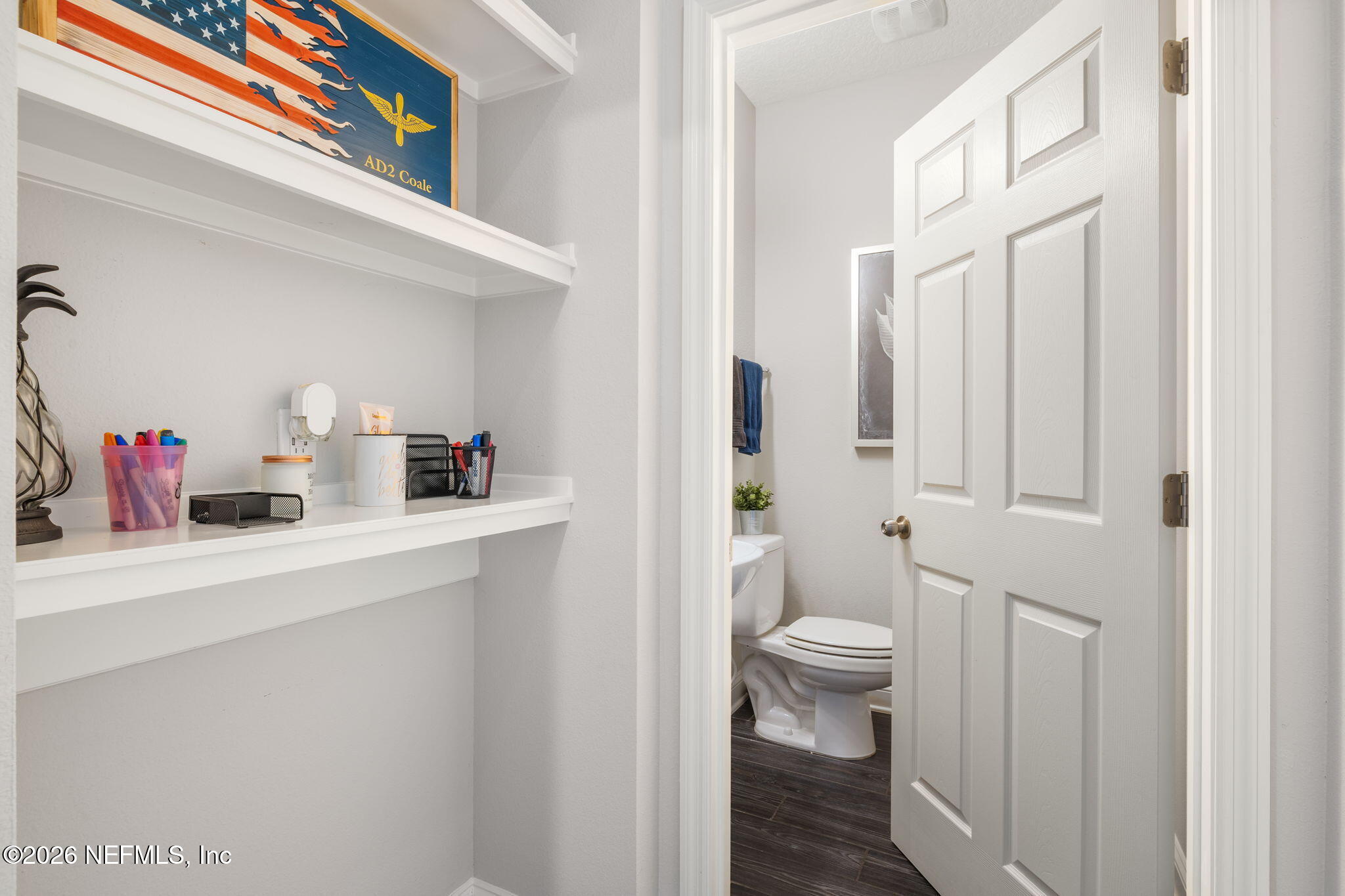 28 Focal Court St. Augustine, FL 32095 - Photo 23 of 54 a bathroom with a sink a toilet and a shower curtain