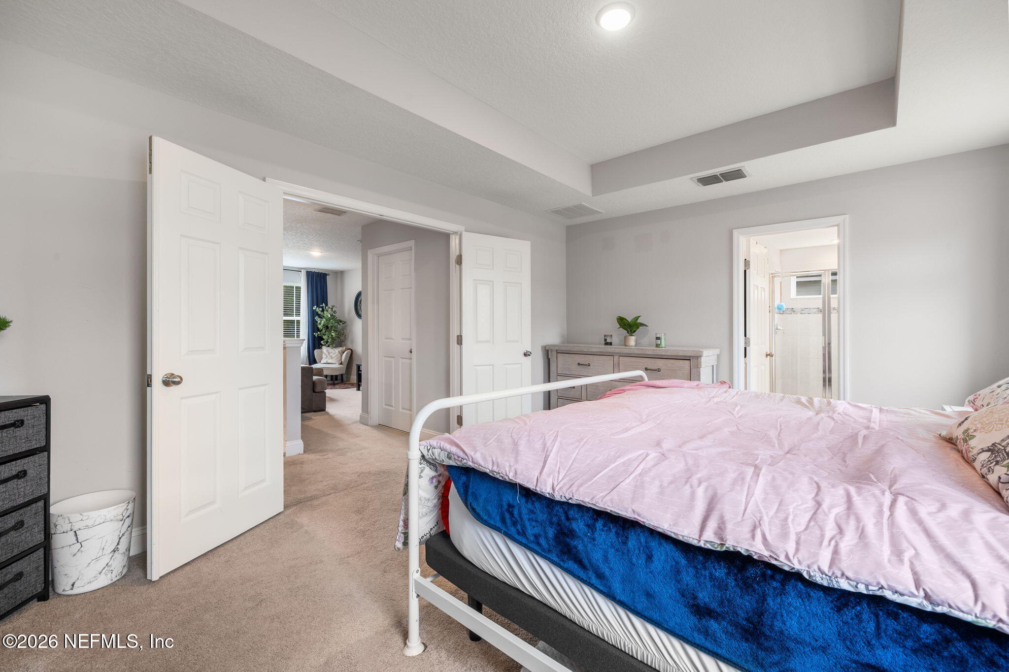 28 Focal Court St. Augustine, FL 32095 - Photo 28 of 54 a bed room with a bed and a mirror