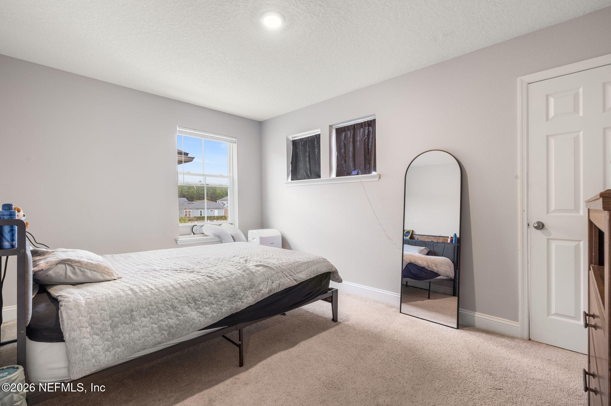 28 Focal Court St. Augustine, FL 32095 - Photo 33 of 54 a bedroom with a bed and a dresser