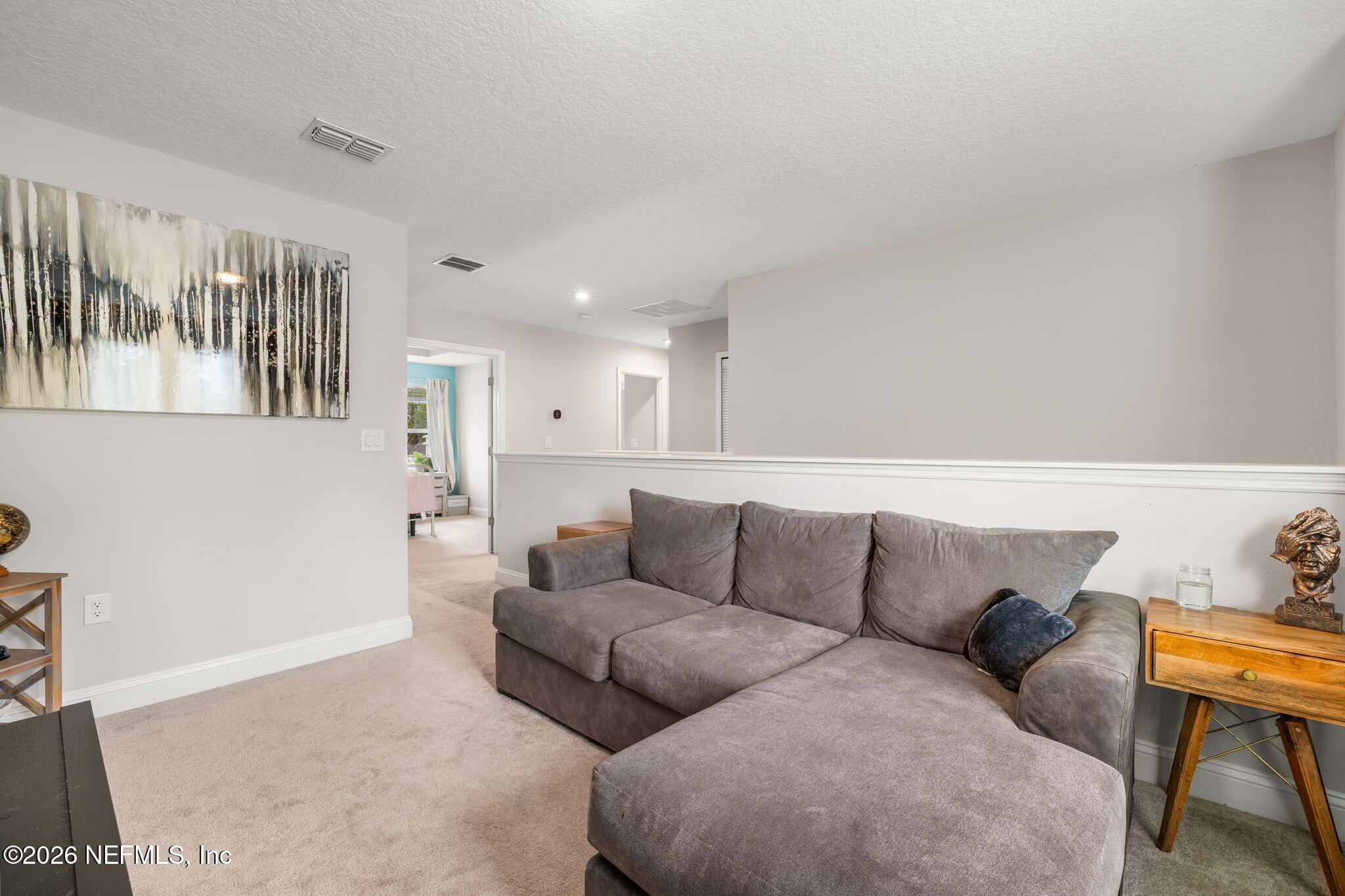 28 Focal Court St. Augustine, FL 32095 - Photo 41 of 54 a living room with furniture and a couch