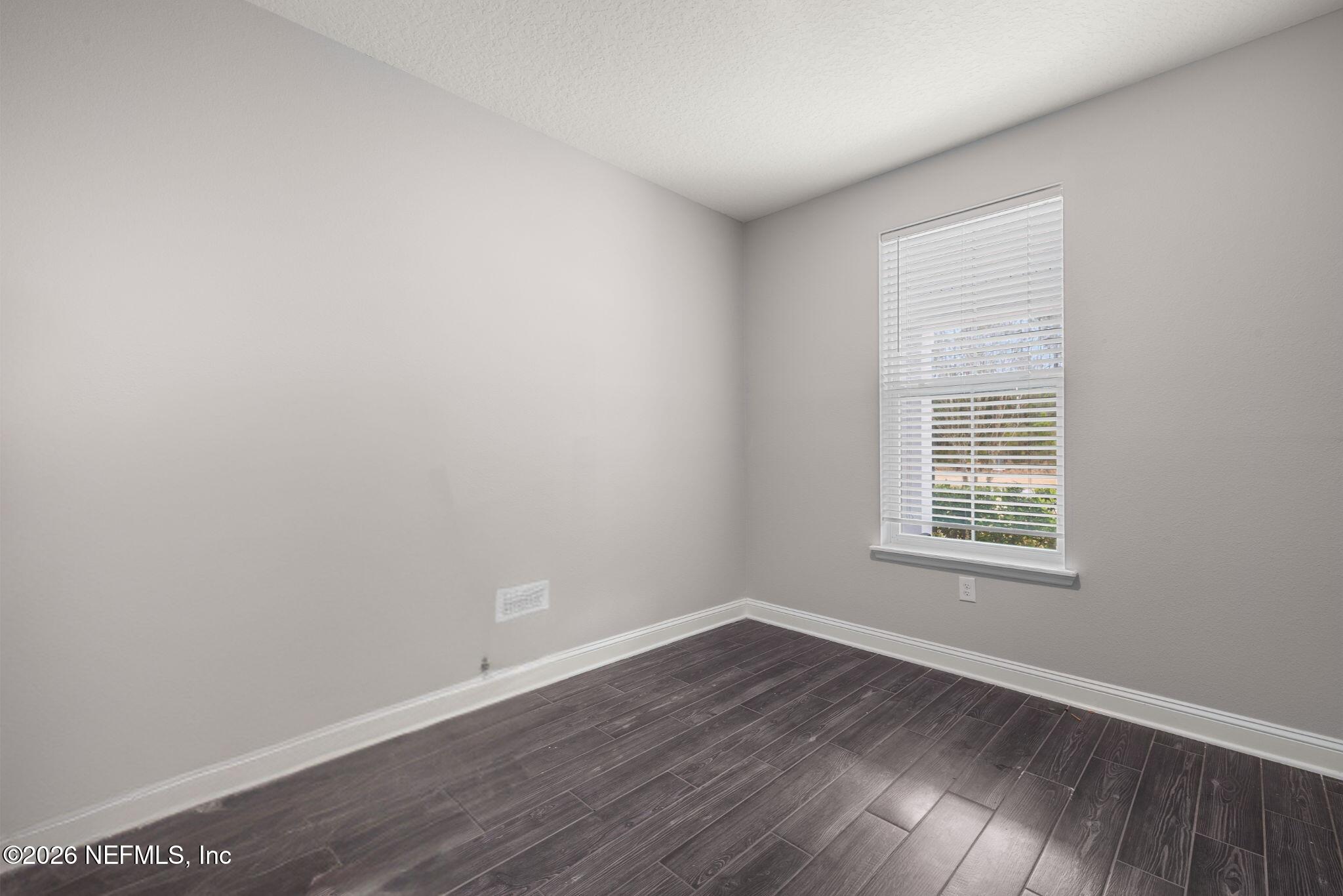 28 Focal Court St. Augustine, FL 32095 - Photo 43 of 54 a view of an empty room with wooden floor and a window