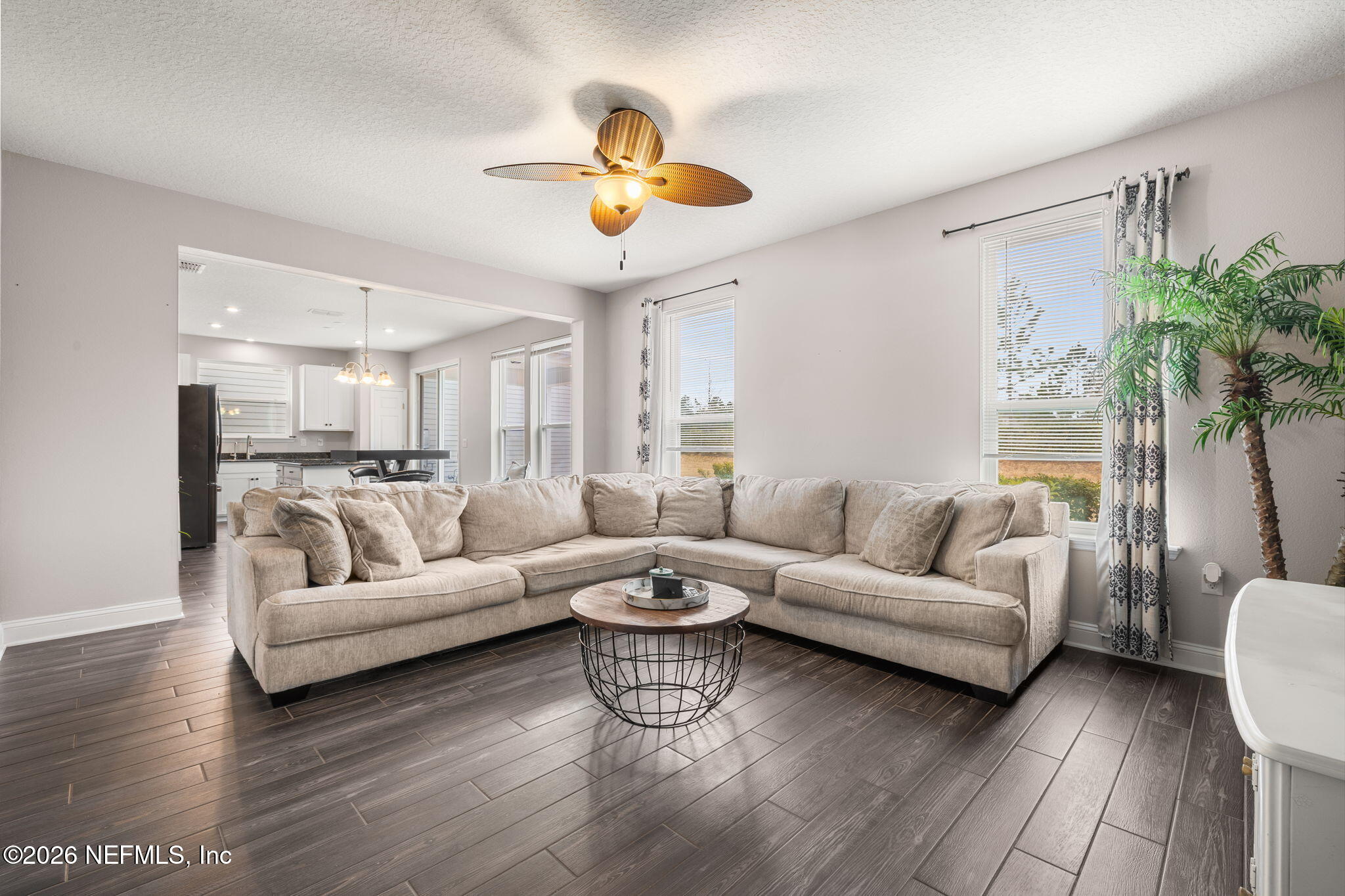 28 Focal Court St. Augustine, FL 32095 - Photo 6 of 54 a living room with furniture kitchen view and a chandelier