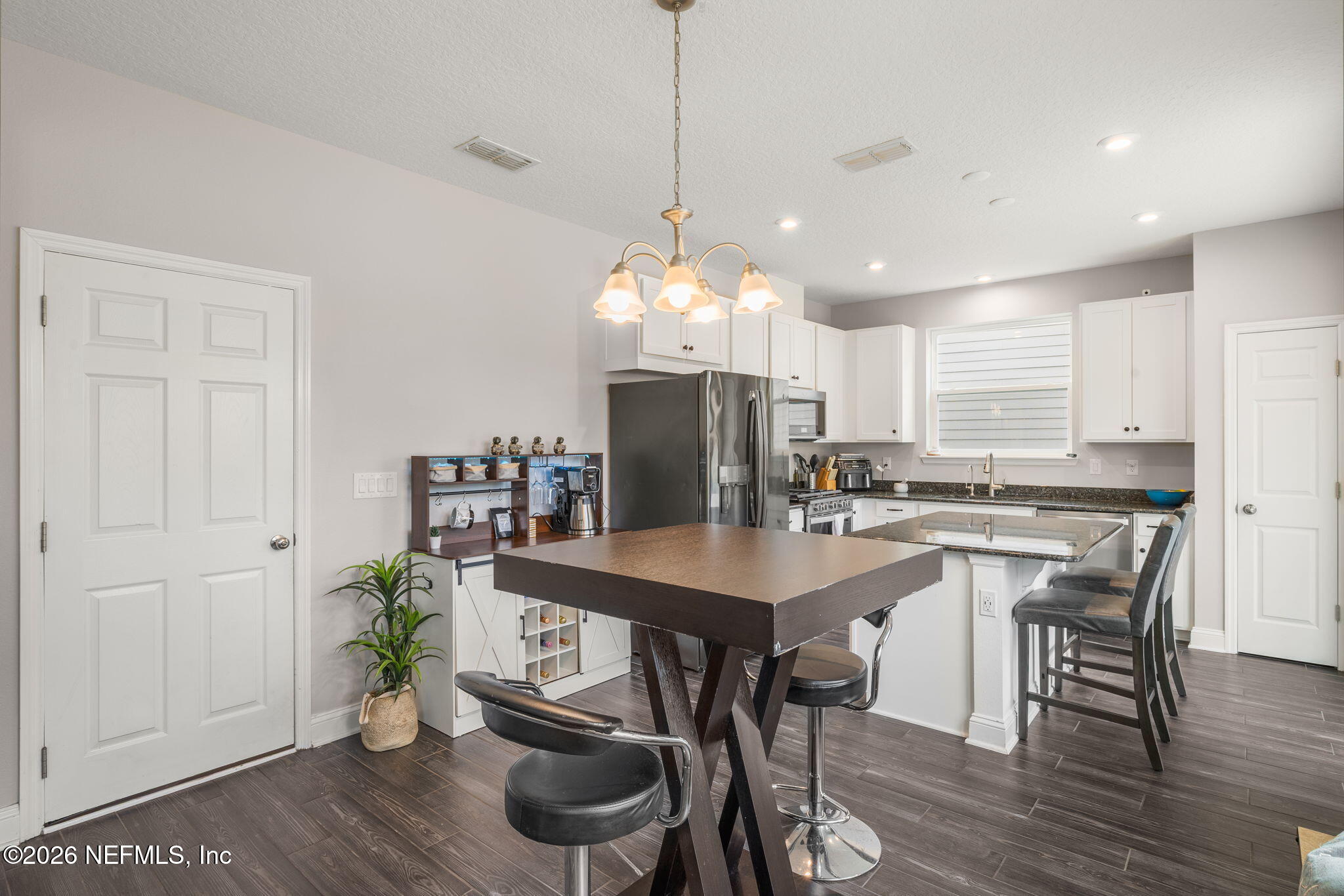 28 Focal Court St. Augustine, FL 32095 - Photo 9 of 54 a kitchen with a table and chairs in it