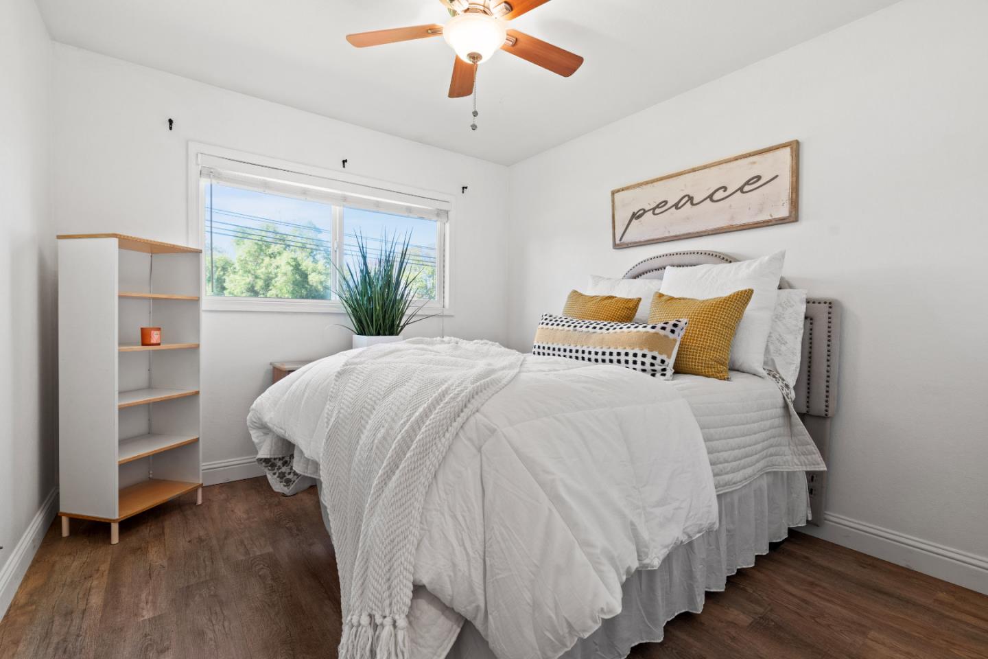 1706 Ayers Road Concord, CA 94521 - Photo 12 of 60 a bedroom with bed and wooden floor
