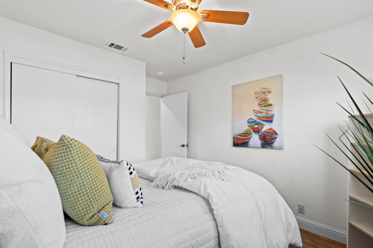 1706 Ayers Road Concord, CA 94521 - Photo 13 of 60 a bedroom with a bed and a chandelier