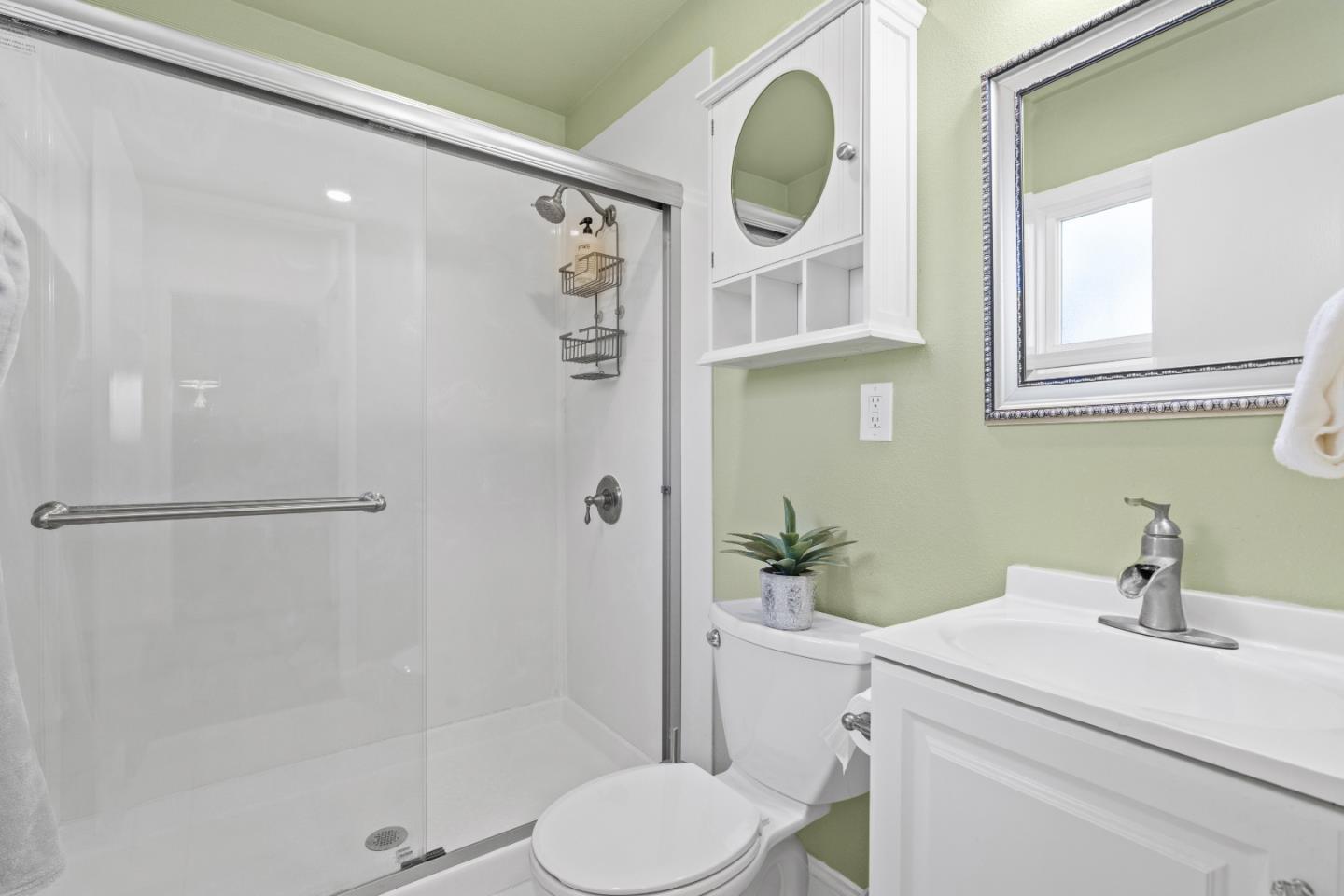 1706 Ayers Road Concord, CA 94521 - Photo 18 of 60 a bathroom with a sink a toilet and shower