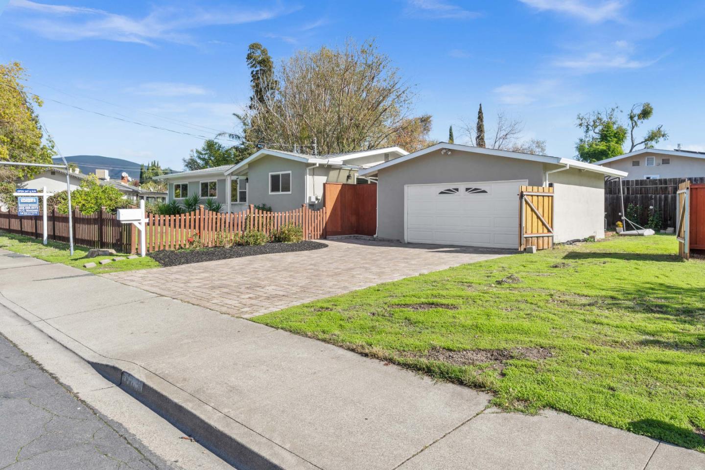 1706 Ayers Road Concord, CA 94521 - Photo 33 of 60 a front view of a house with a yard and garage