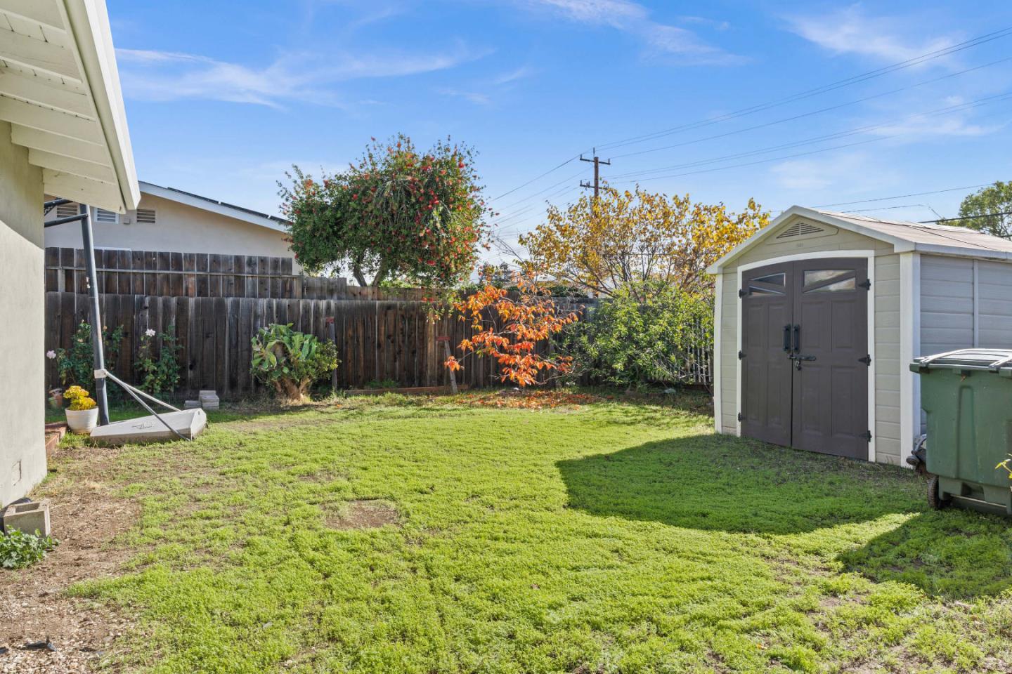 1706 Ayers Road Concord, CA 94521 - Photo 39 of 60 a view of a backyard with potted plants and wooden fence