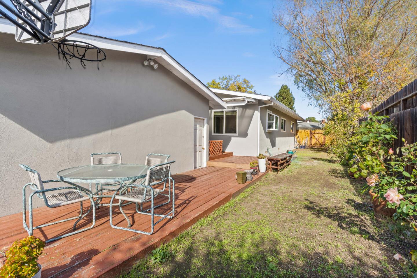 1706 Ayers Road Concord, CA 94521 - Photo 41 of 60 a view of a patio with table and chairs with wooden fence and plants