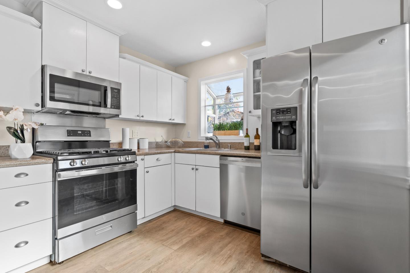 1706 Ayers Road Concord, CA 94521 - Photo 6 of 60 a kitchen with stainless steel appliances granite countertop a stove a refrigerator and a microwave
