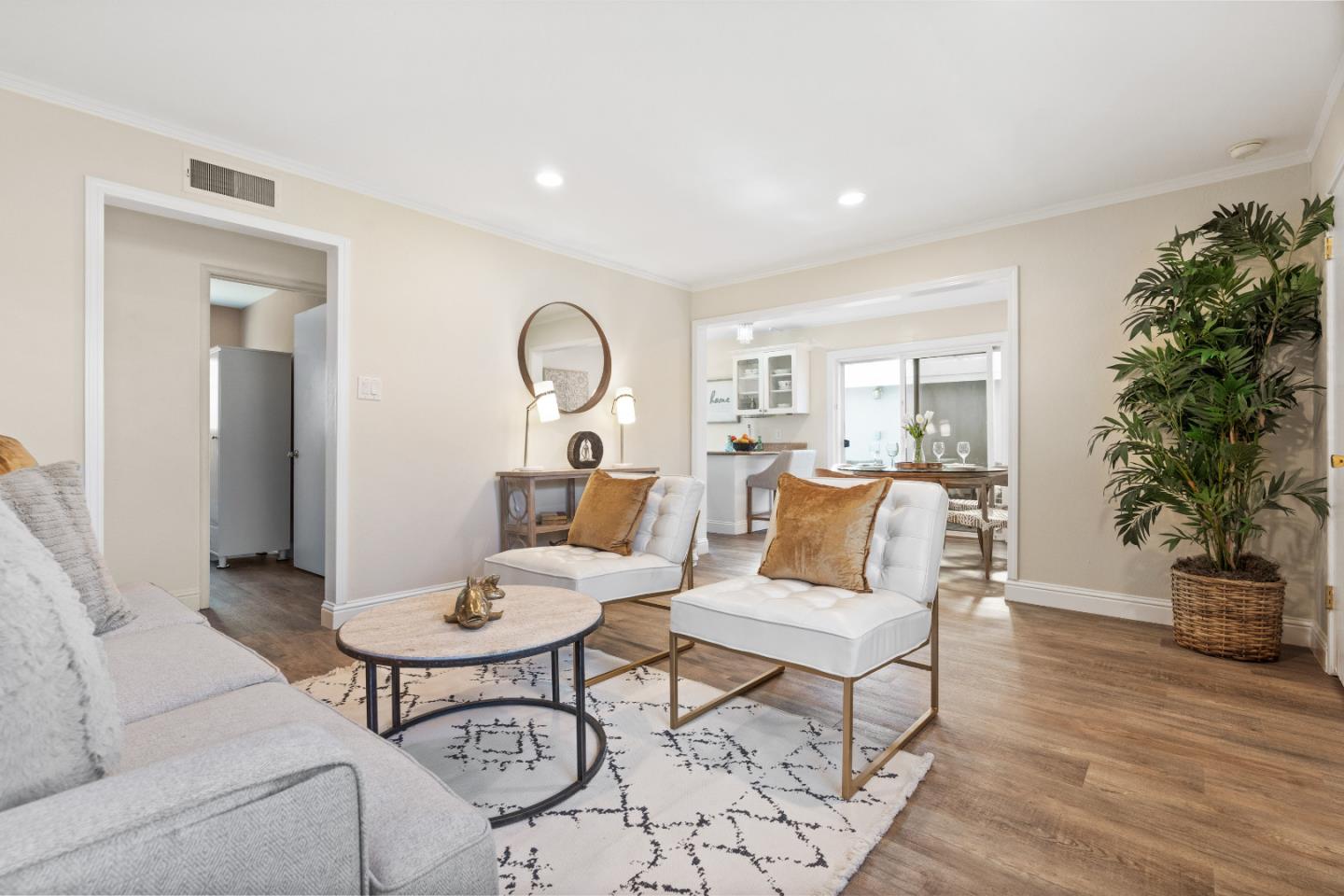 1706 Ayers Road Concord, CA 94521 - Photo 57 of 60 a living room with furniture a wooden floor and a potted plant