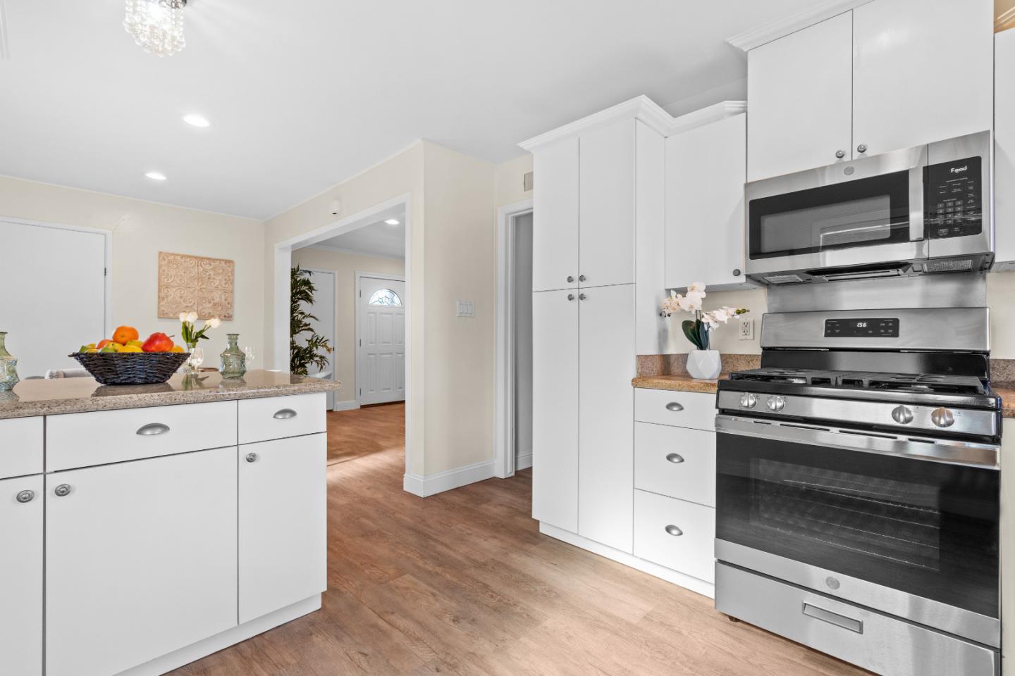 1706 Ayers Road Concord, CA 94521 - Photo 7 of 60 a kitchen with stainless steel appliances white cabinets and a stove a oven with white countertops