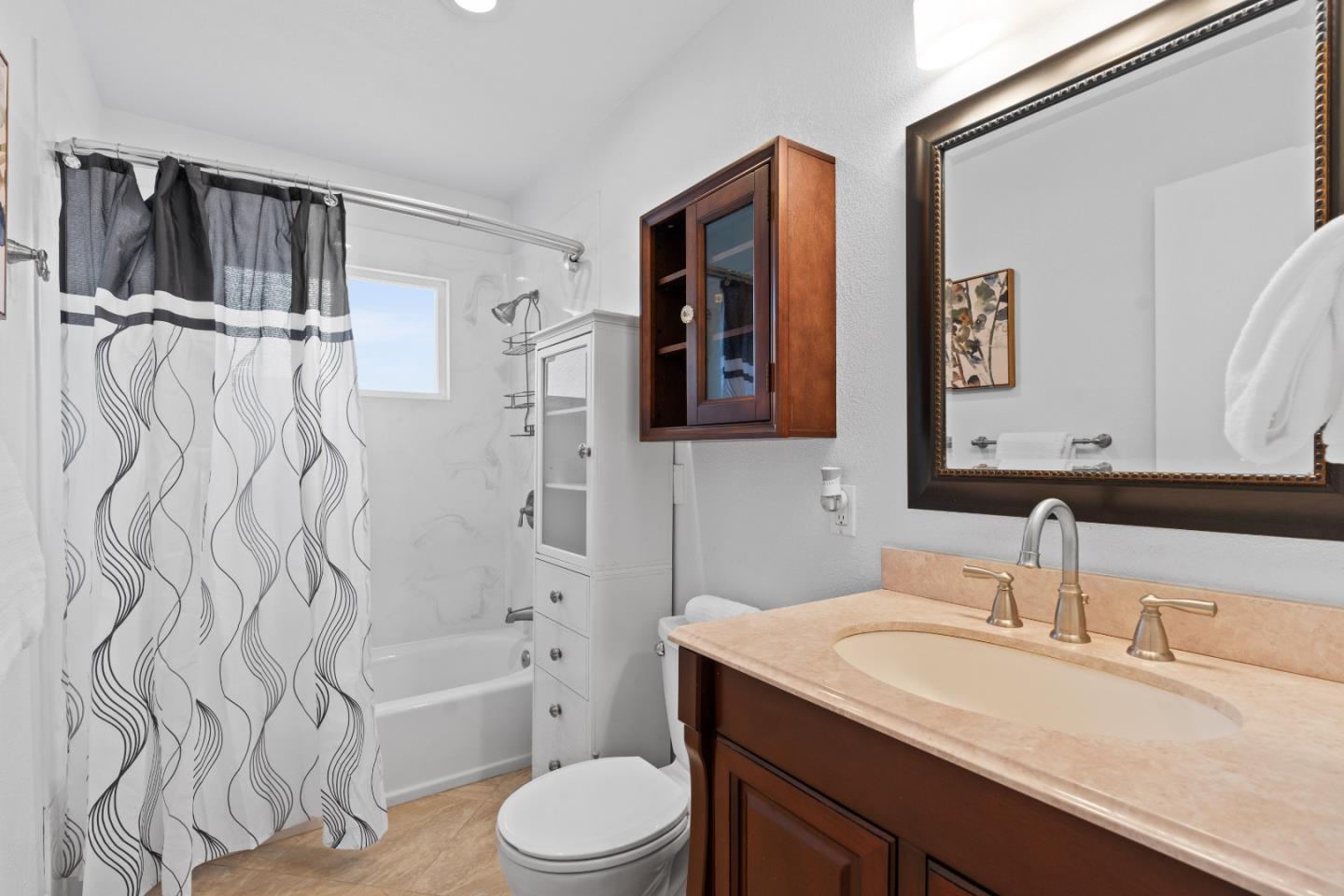 1706 Ayers Road Concord, CA 94521 - Photo 9 of 60 a bathroom with a granite countertop sink toilet and shower