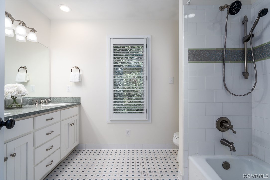10645 Cherokee Road Richmond, VA 23235 - Photo 31 of 45 a bathroom with a granite countertop sink a toilet and shower