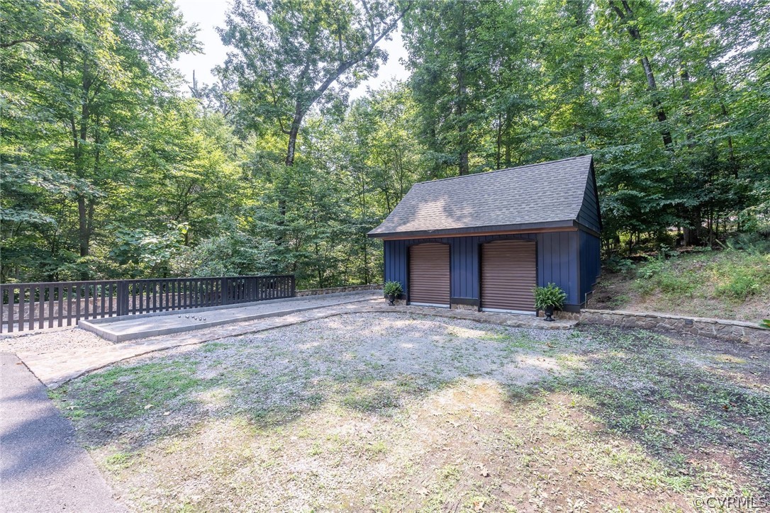 10645 Cherokee Road Richmond, VA 23235 - Photo 42 of 45 a house with trees in front of it
