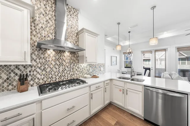 a kitchen with a sink a stove and cabinets