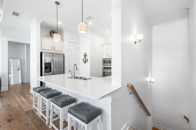 a kitchen with stainless steel appliances granite countertop a stove and a sink