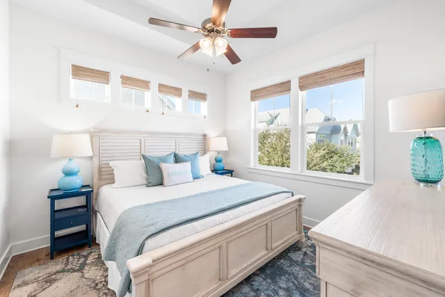 a bedroom with a large bed and a large window