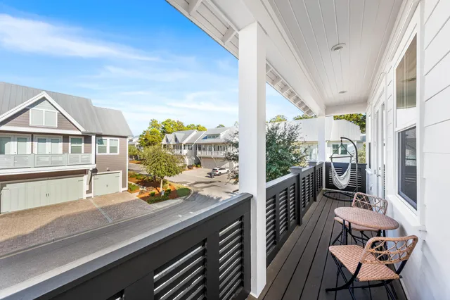 a view of a balcony with chairs