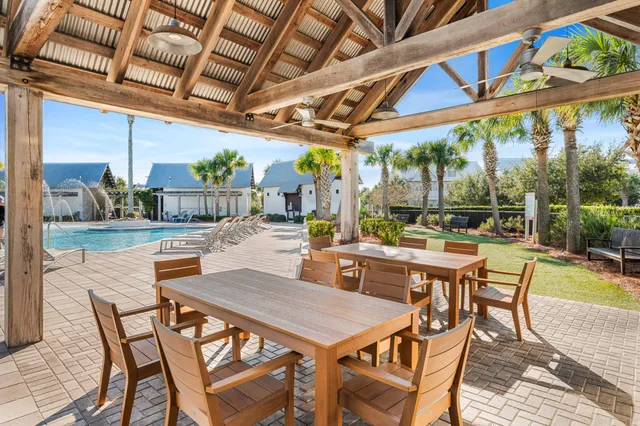 a patio with a table and chairs
