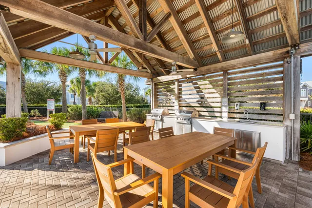 a view of a patio with a table and chairs