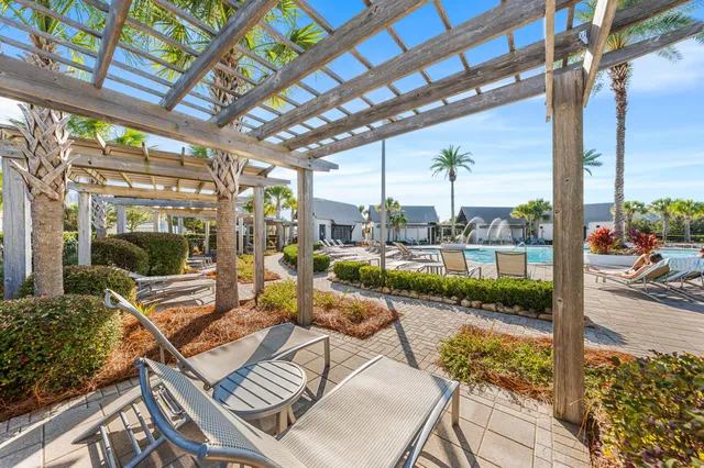 a view of swimming pool with outdoor seating