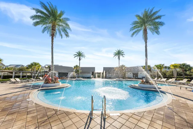 a view of a swimming pool and lounge chair