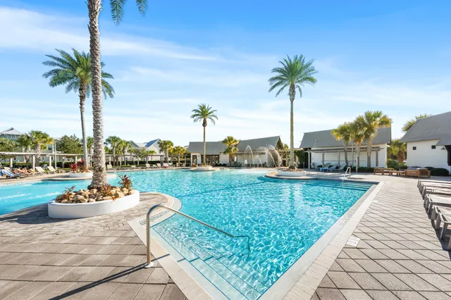a view of a house with a patio and a garden