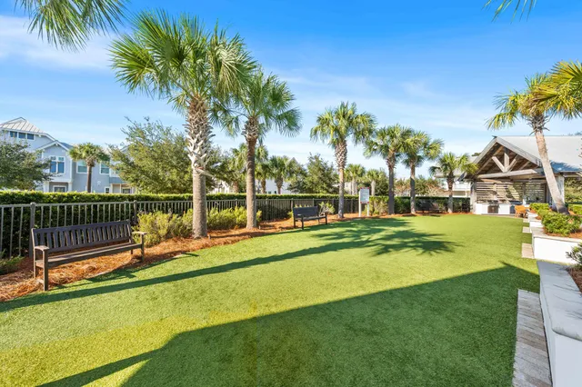 a view of a house with swimming pool and a yard