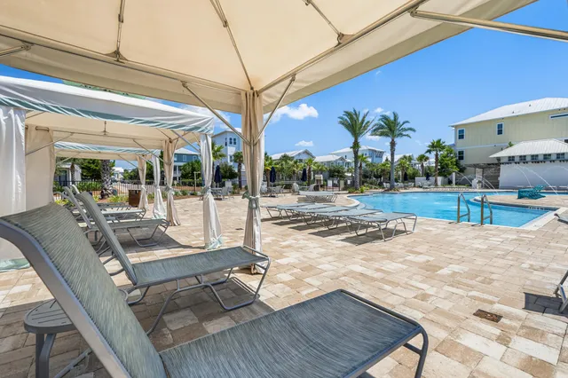 a view of a patio with a table and chairs