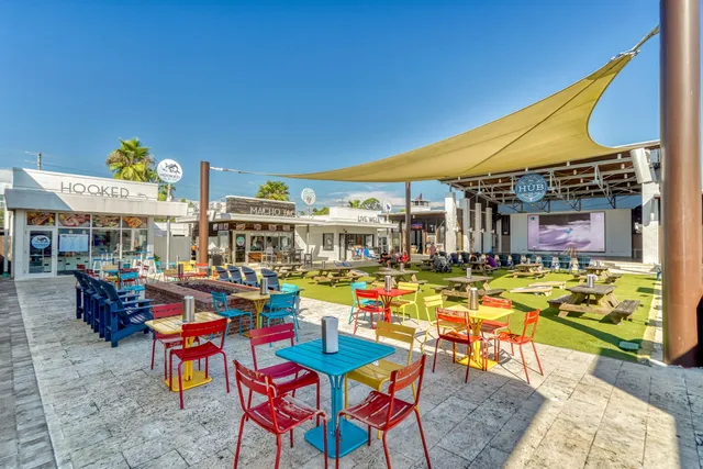 a area with lots of table and chairs