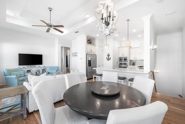 a large kitchen with a table and chairs