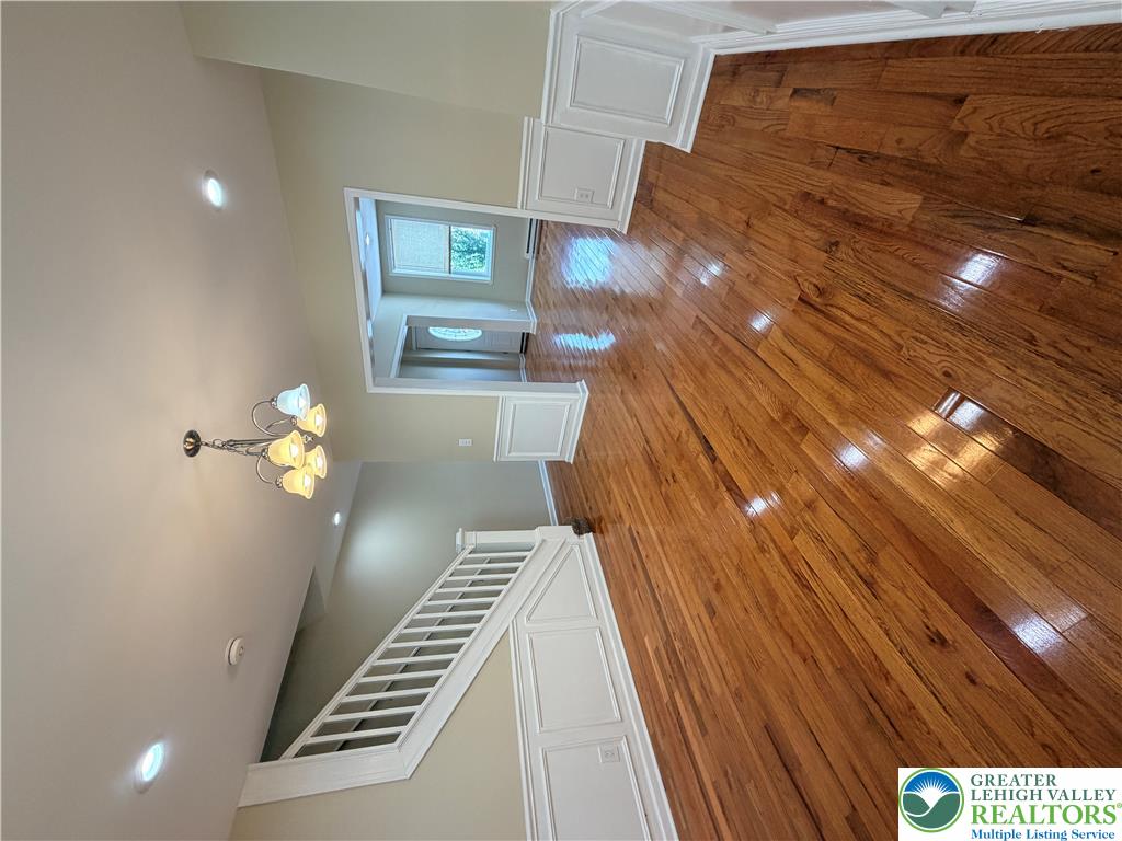 718 Ferry Street Easton, PA 18042 - Photo 4 of 37 Gleaming hardwood flooring stretches through this open-concept entry and living area.