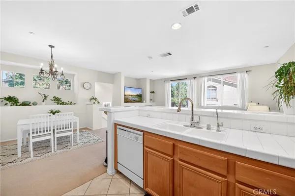 a spacious bathroom with a double vanity sink and a mirror