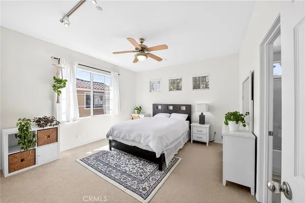 a living room with furniture lamp and rug