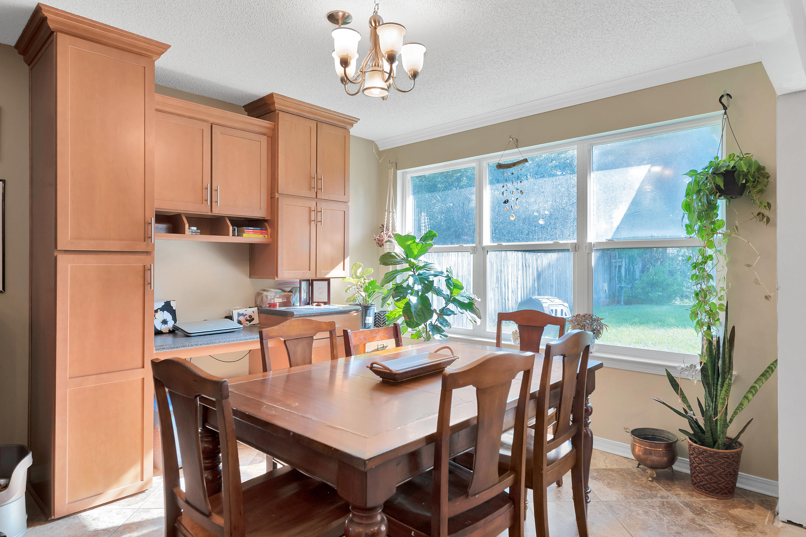 2734 Augustus Road Navarre, FL 32566 - Photo 11 of 23 a view of a dining room with furniture window and wooden floor