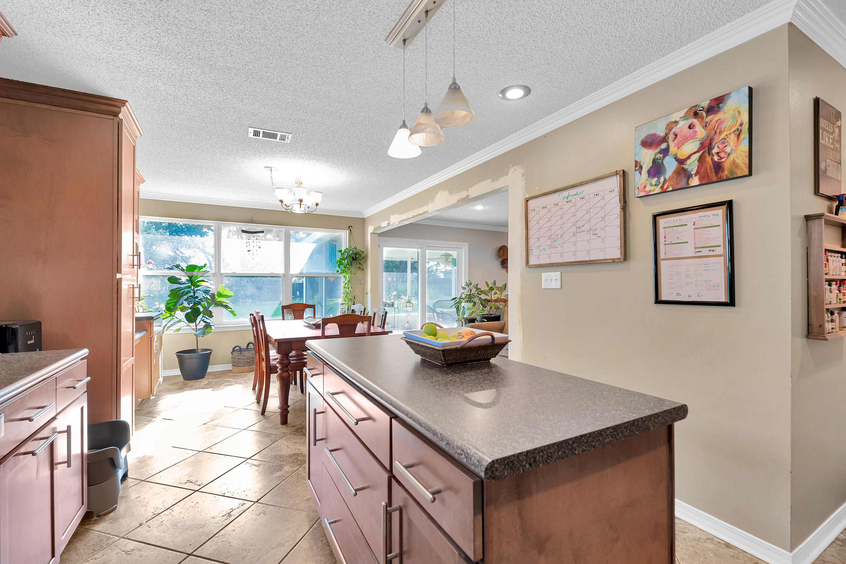 2734 Augustus Road Navarre, FL 32566 - Photo 15 of 23 a view of kitchen island with furniture and couch