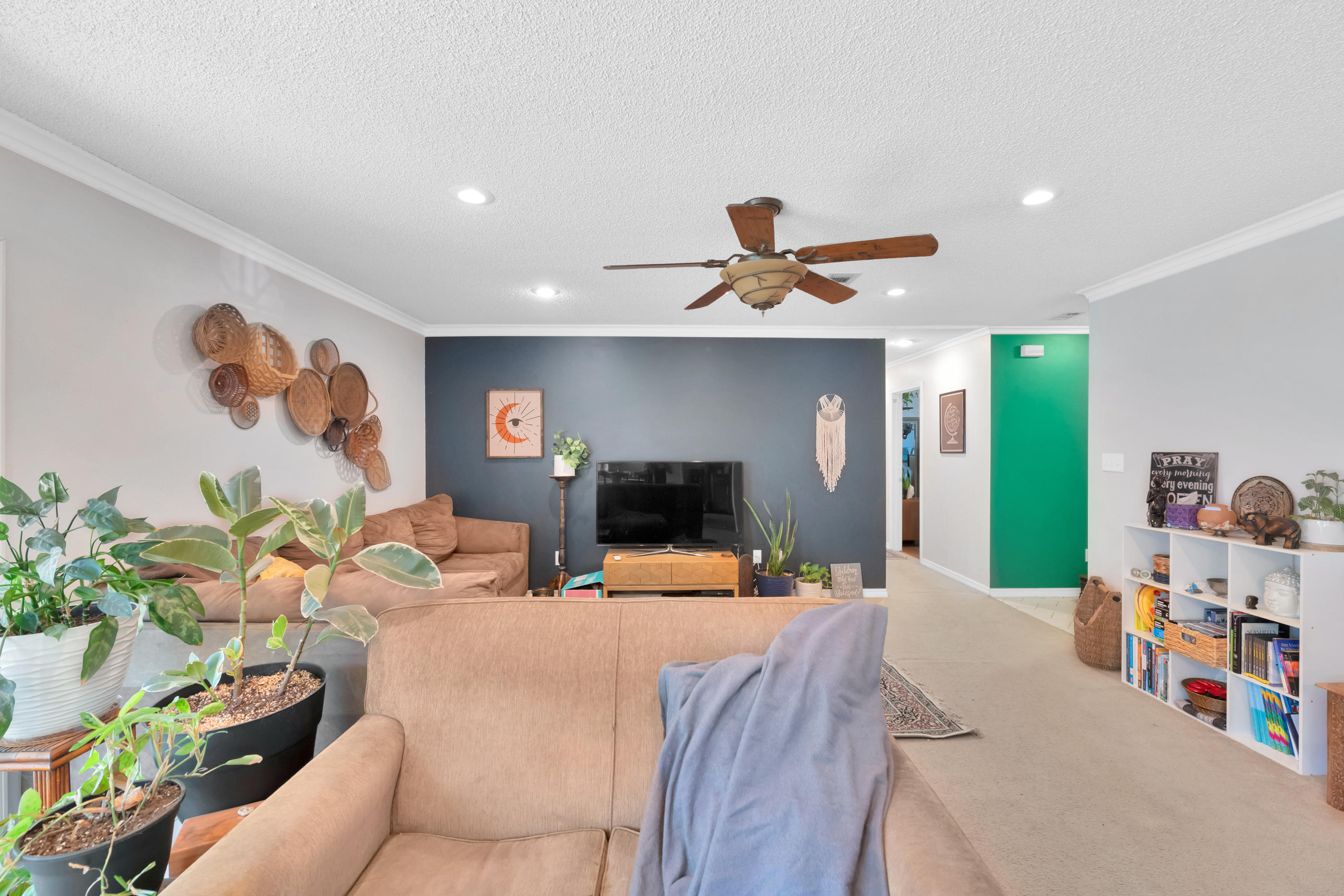 2734 Augustus Road Navarre, FL 32566 - Photo 18 of 23 a living room with furniture and a flat screen tv