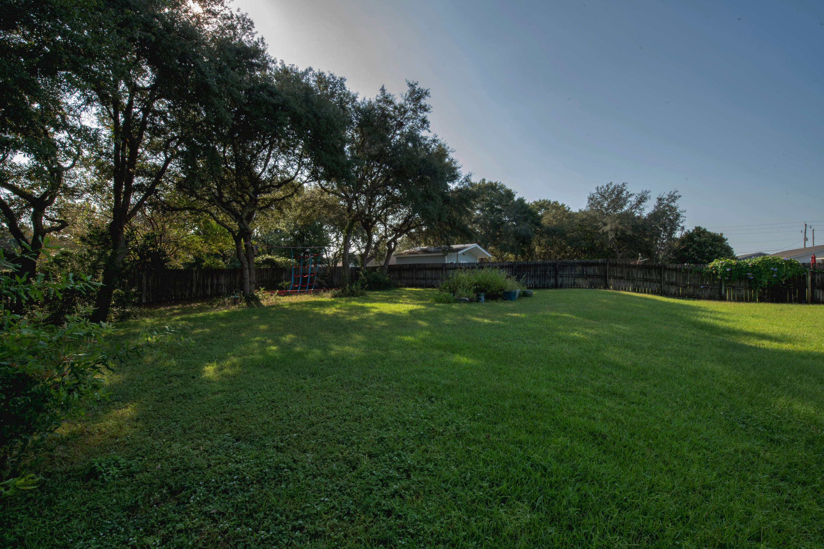 2734 Augustus Road Navarre, FL 32566 - Photo 20 of 23 a view of outdoor space with deck and yard