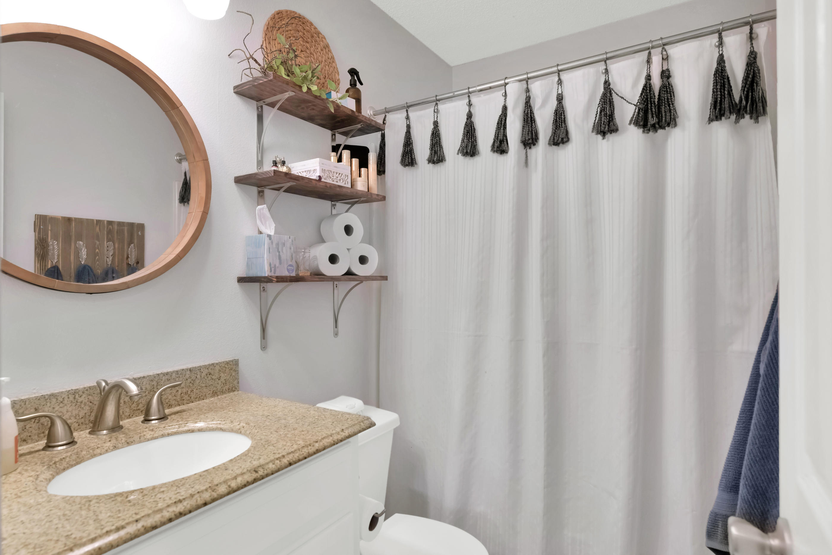 2734 Augustus Road Navarre, FL 32566 - Photo 2 of 23 a bathroom with a sink vanity granite and a mirror
