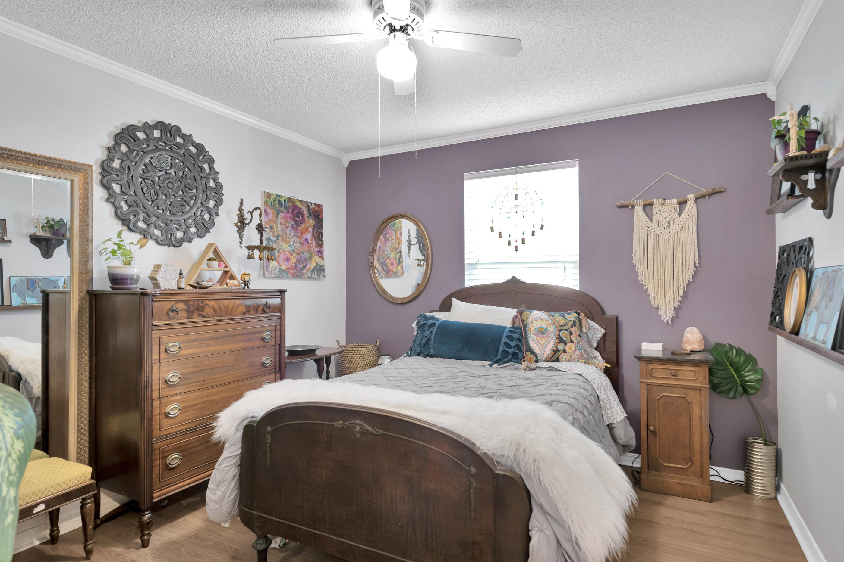 2734 Augustus Road Navarre, FL 32566 - Photo 3 of 23 a bedroom with a bed and paintings on the wall