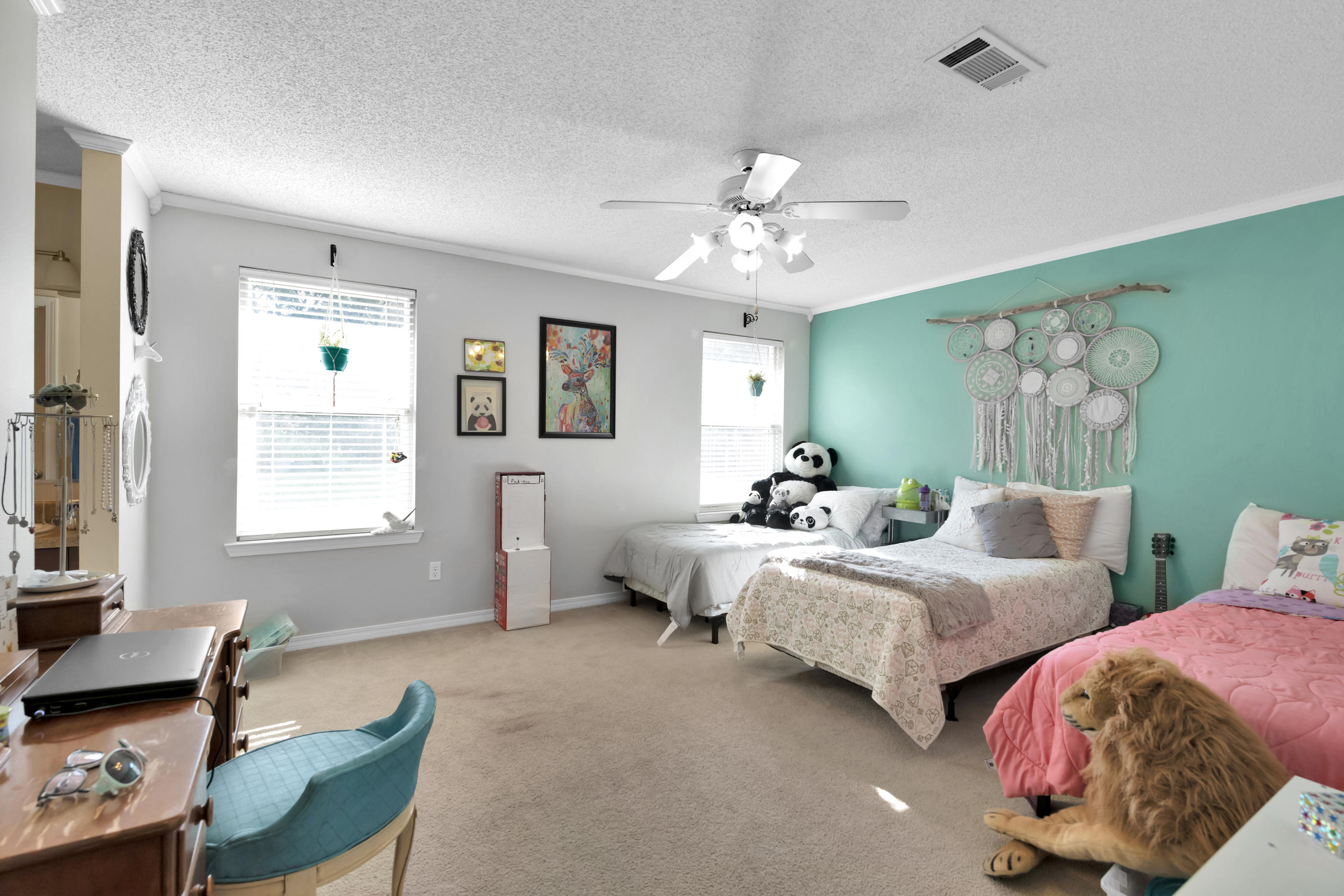 2734 Augustus Road Navarre, FL 32566 - Photo 5 of 23 a spacious bedroom with two beds and a chair