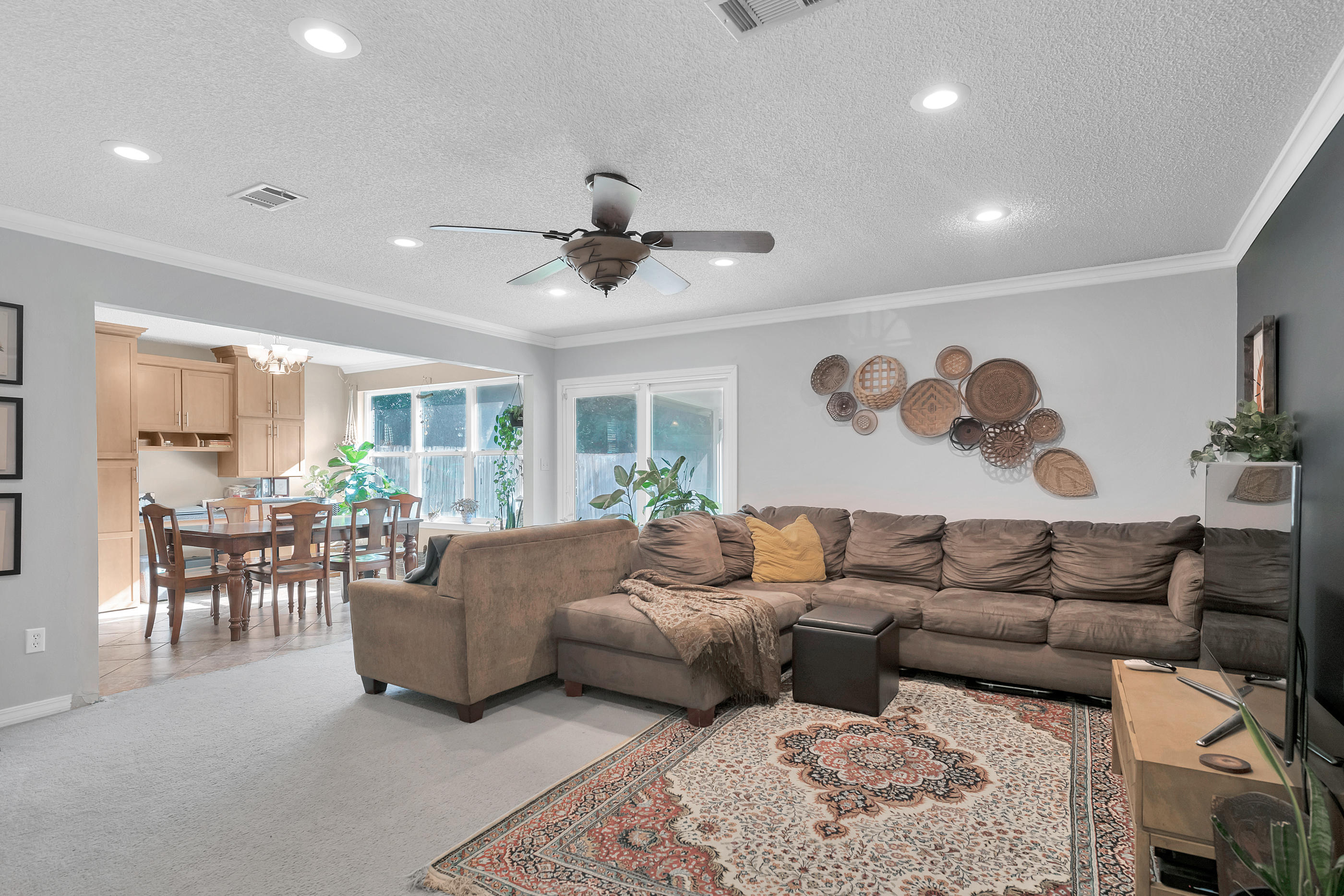 2734 Augustus Road Navarre, FL 32566 - Photo 9 of 23 a living room with furniture and a large window