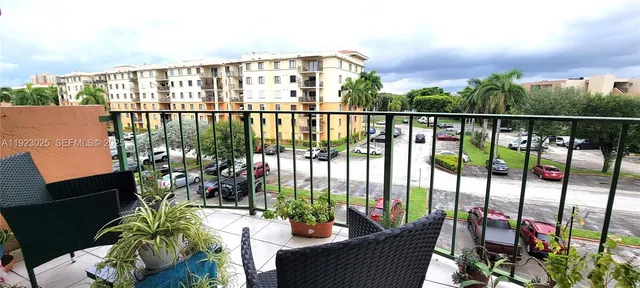 a view of a balcony with chairs